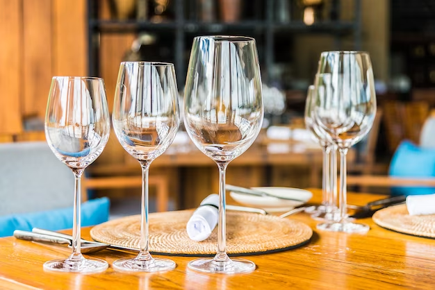Wine glasses resting on a wooden table